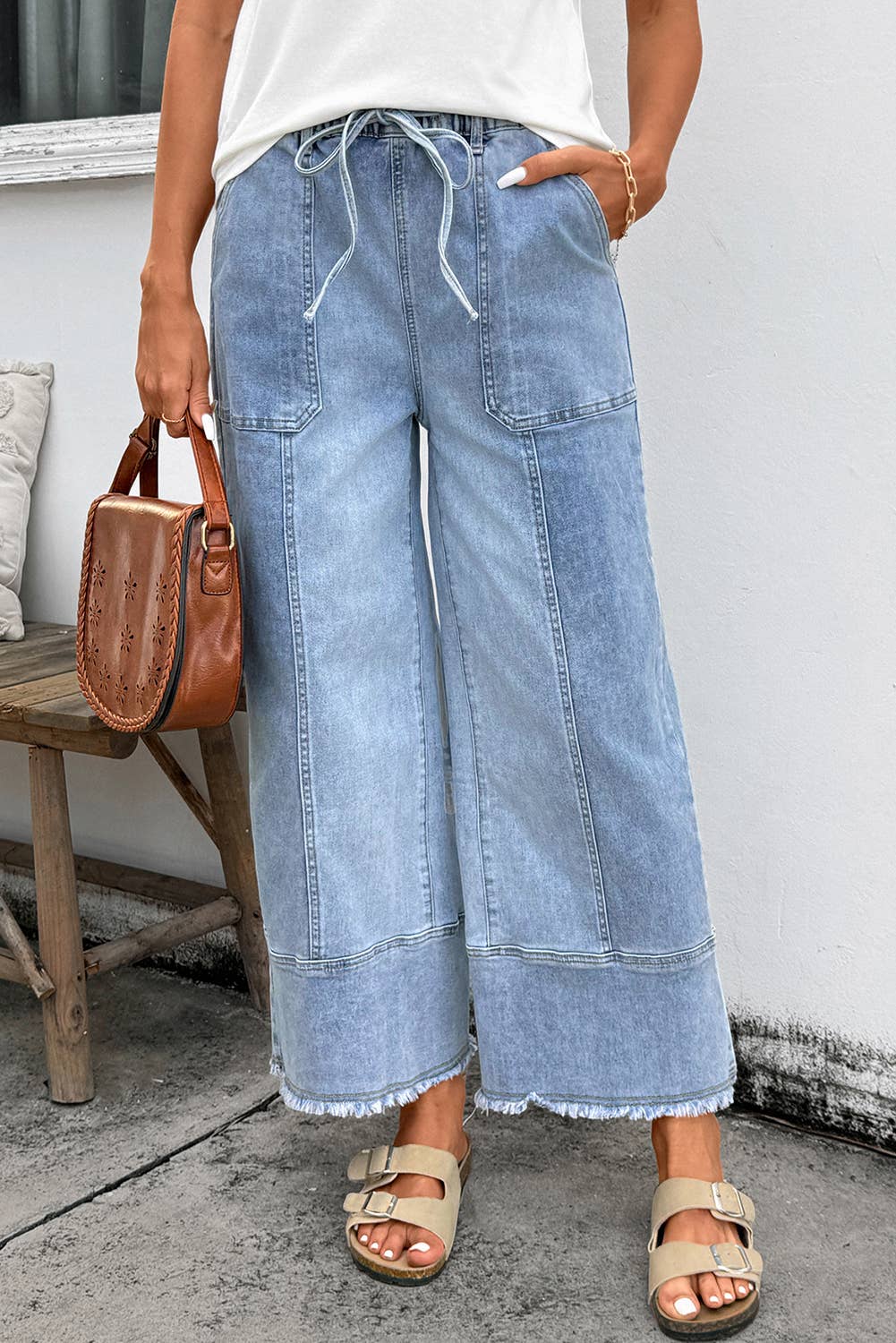 Someone wears the 1 the Woman Drawstring Seam Detail Raw Hem Wide Leg Denim Pants, beige sandals, a white top, and carries a brown leather handbag. Main image