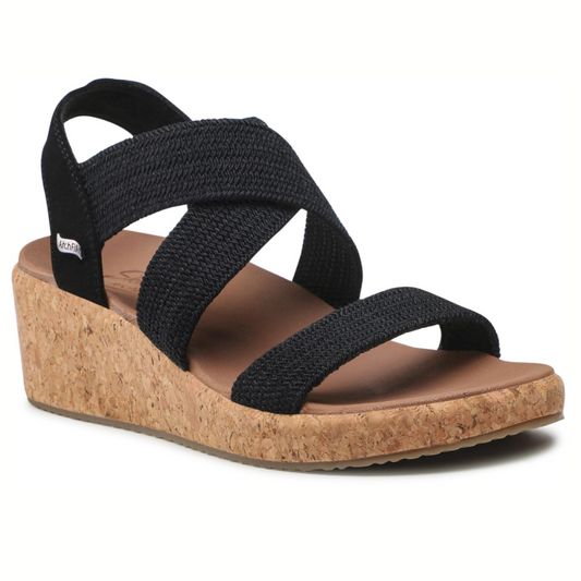 Black strappy Arch Fit Beverlee wedge sandal with cork heel for enhanced comfort and support by SKECHERS USA INC.