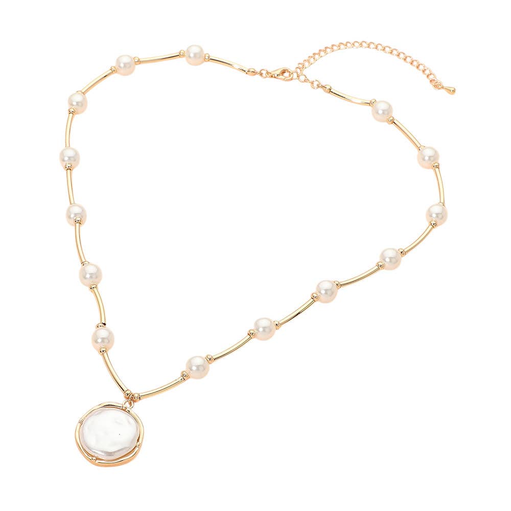 The Sensibling Corp. Round Pearl Pendant Station Necklace features evenly spaced pearls and a large round pendant, complete with an adjustable chain clasp for the perfect fit.