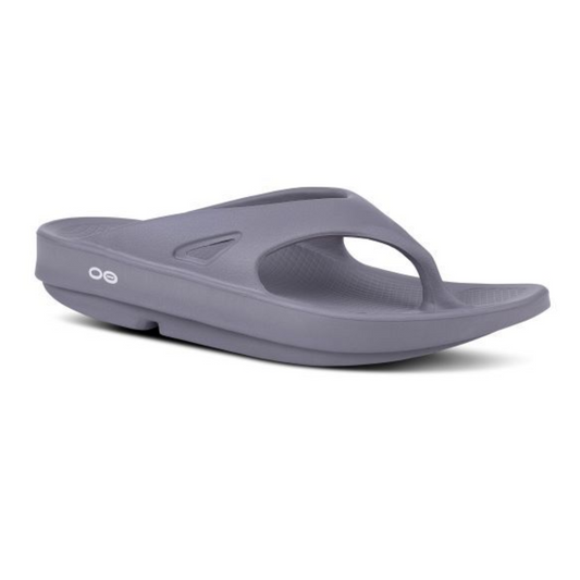 A gray Ooriginal Thong Sandal in Slate by Oofos with a toe strap and thick sole, designed for comfort. The OOFOS LLC brand logo is visible on the side.