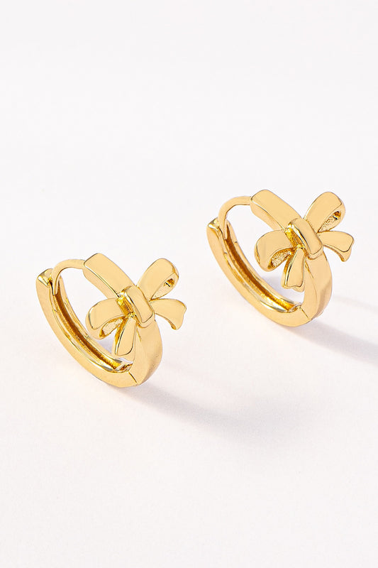 A pair of FASHION GO Brass Bow Huggie Hoop Earrings, displayed on a plain white background.