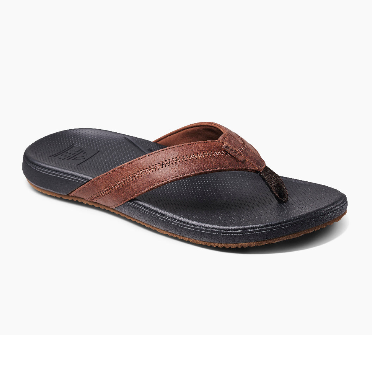 The REEF CUSHION Phantom 2.0 LE Flip Flop in Brown/Black offers a cushioned design with a textured sole and wide strap, blending comfort and style seamlessly.