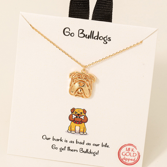 Gold dipped bulldog pendant necklace by FASHION GO on a display card with "go bulldogs" text, mascot illustration, and slogan "our bark is as bad as our bite.