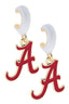 Show your Alabama Crimson Tide spirit with the Alabama Crimson Tide Enamel Logo Huggie Hoop Earrings by Canvas Style. Each officially licensed earring features a red script “A” with gold trim, hanging from a white huggie hoop—perfect for any fan.