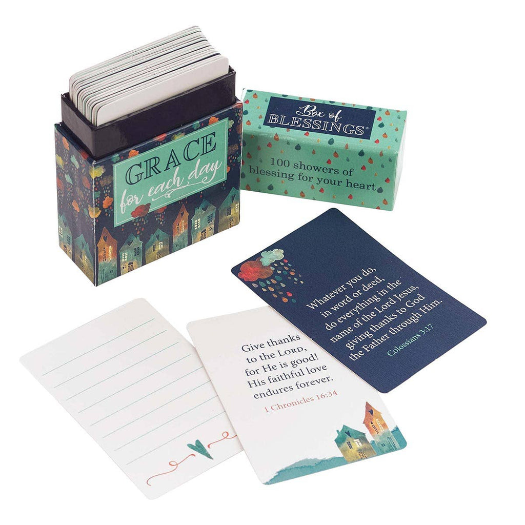 A Box of Blessings Grace for Each Day from Christian Art Gifts sits open, revealing Scripture cards adorned with decorative fonts, each featuring uplifting messages and inspirational Bible verses.