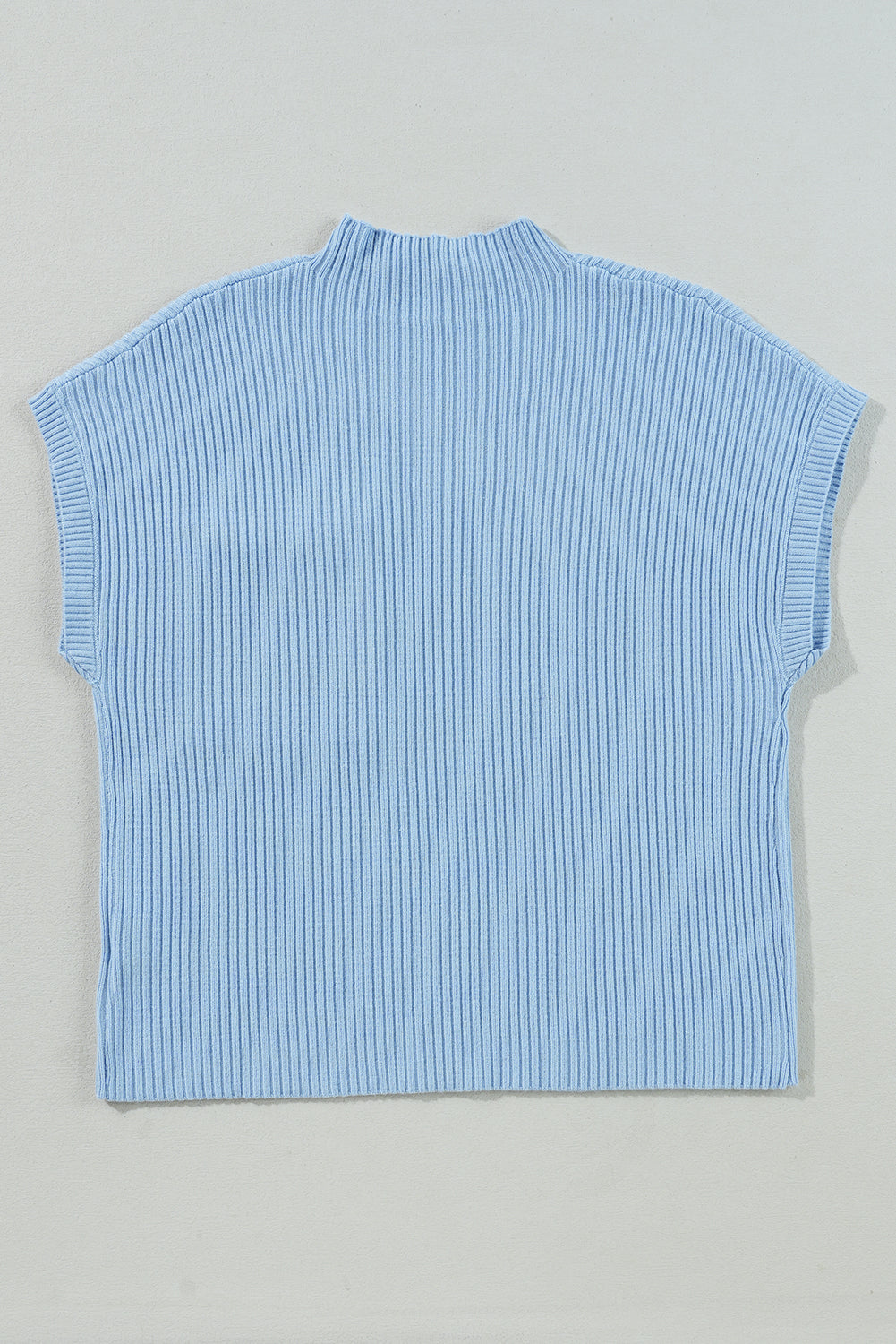 The Patch Pocket Ribbed Knit Short Sleeve Sweater by Shewin is displayed against a simple backdrop, showcasing its light blue hue and transitional weather suitability.