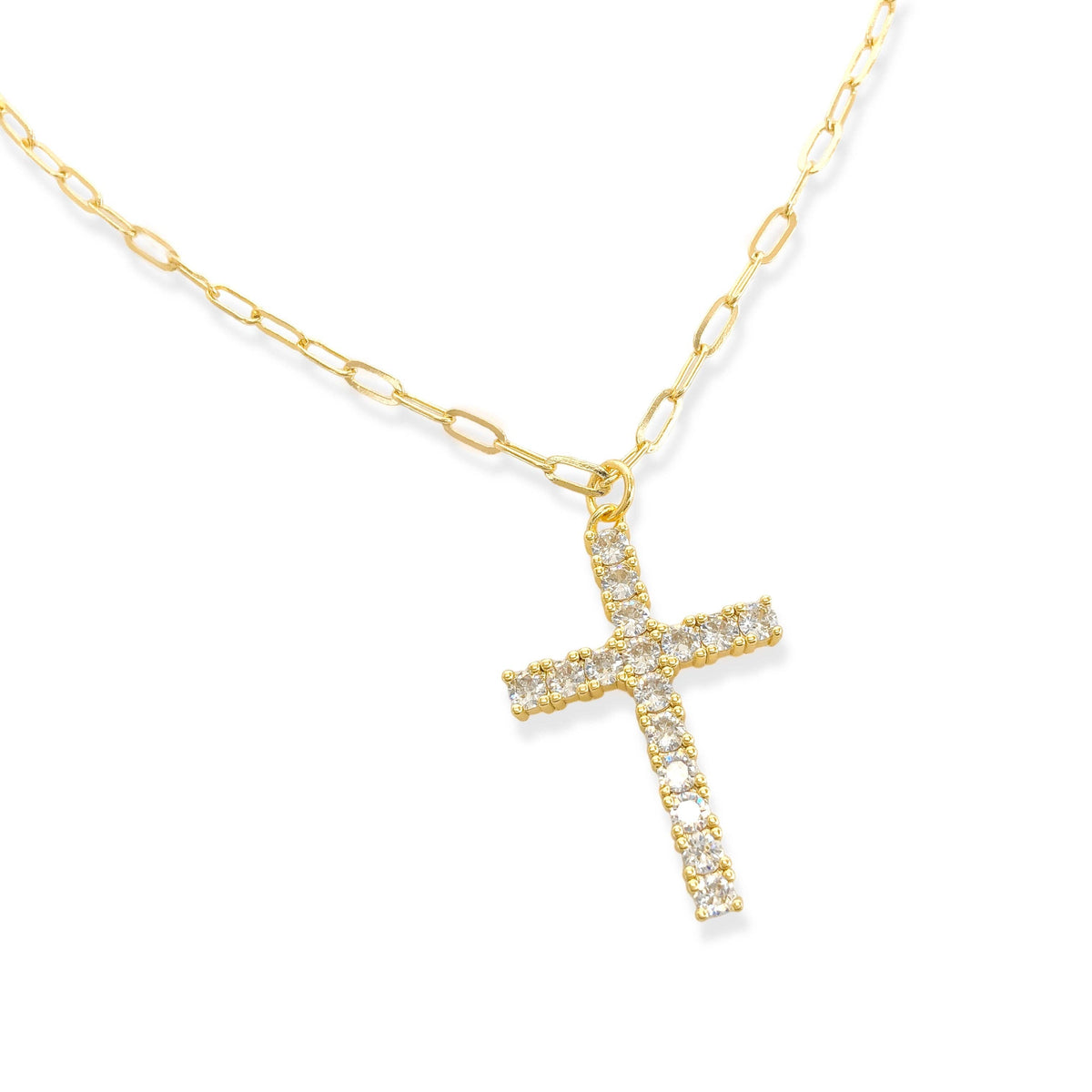 The OMG Blings CZ Cross Necklace showcases a gold-plated chain with a cross pendant adorned with sparkling clear gemstones, presented against a white background. Main image