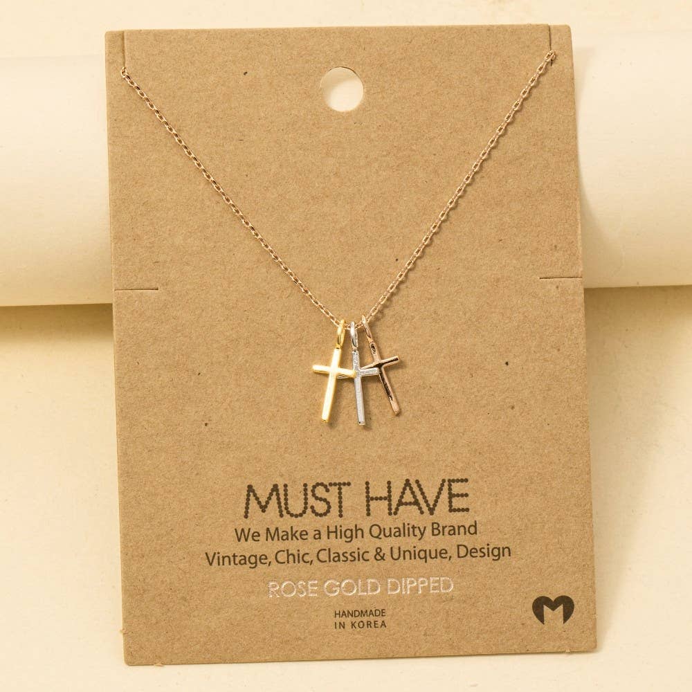 The Anarchy Street Triple Cross Pendant Necklace, gold-dipped in rose gold, comes displayed on a branded brown card labeled "Must Have" and "Handmade in Korea.