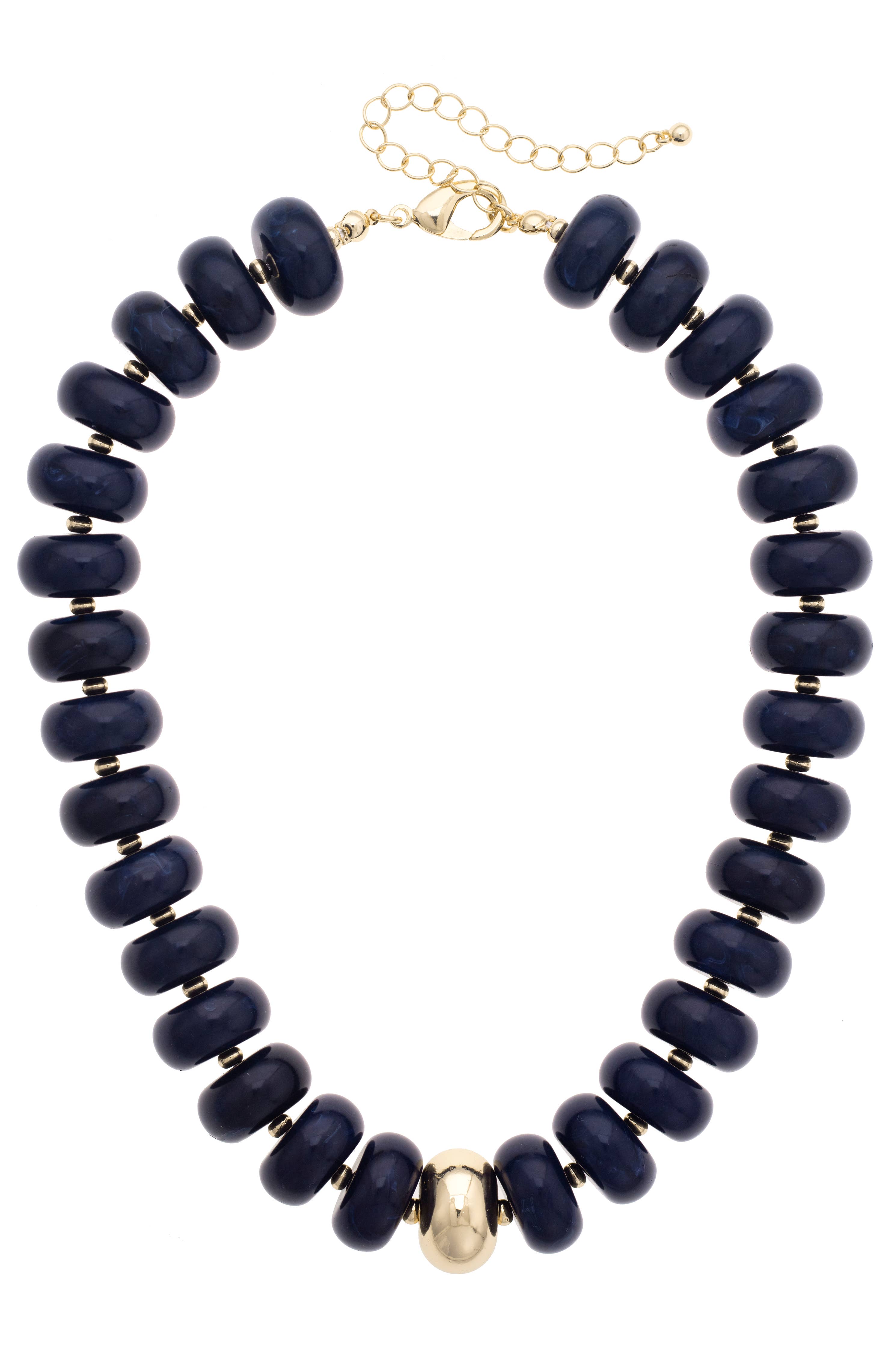 The San Sebastián Beaded Resin Necklace by Canvas Style is a statement piece featuring large dark blue resin beads, a single central gold bead, and is finished with a gold clasp and an adjustable chain.