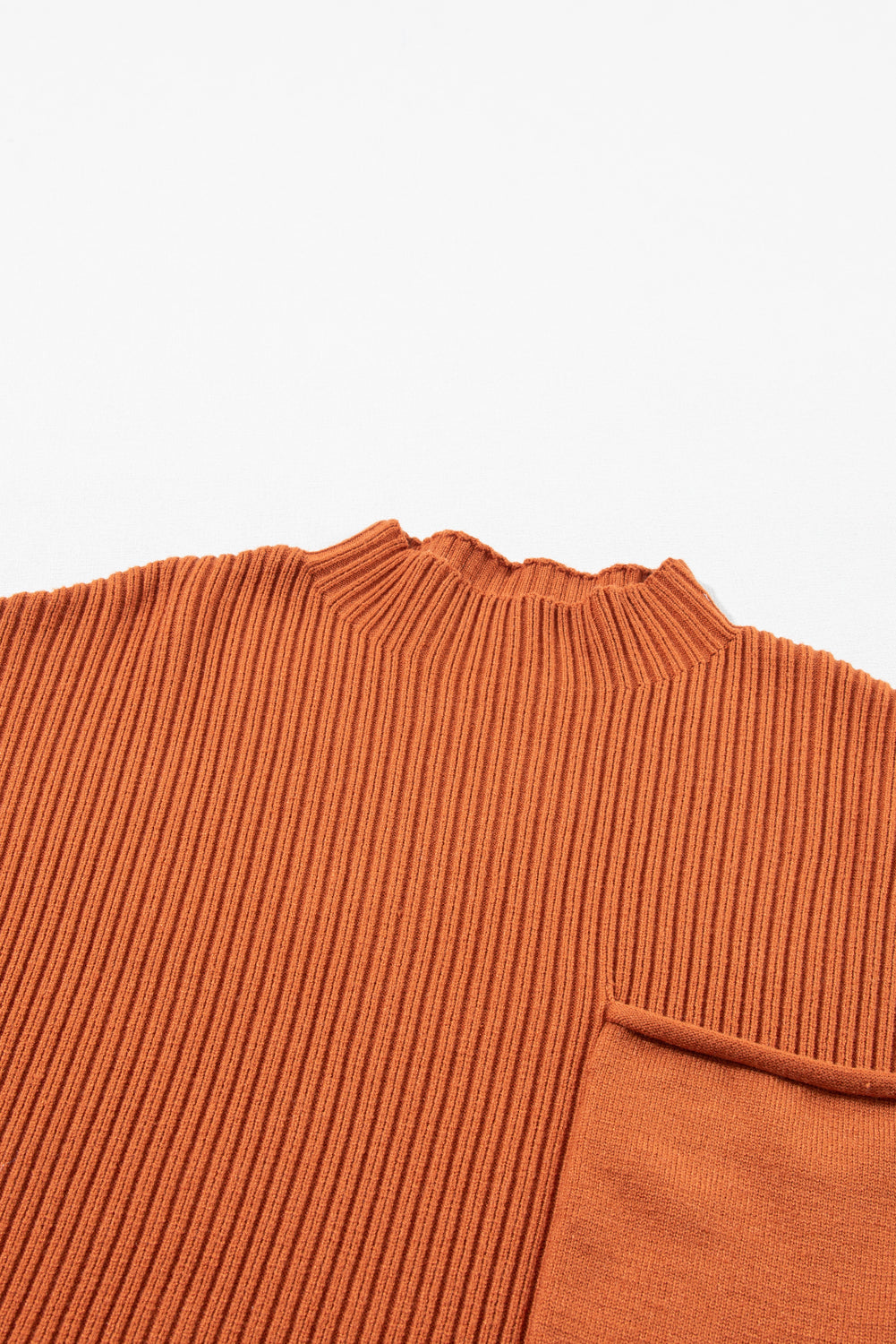 The Patch Pocket Ribbed Knit Short Sleeve Sweater by Shewin is an ideal wardrobe addition for transitional weather. This orange sweater features a high neckline and visible pocket detail, offering a versatile design for various occasions.