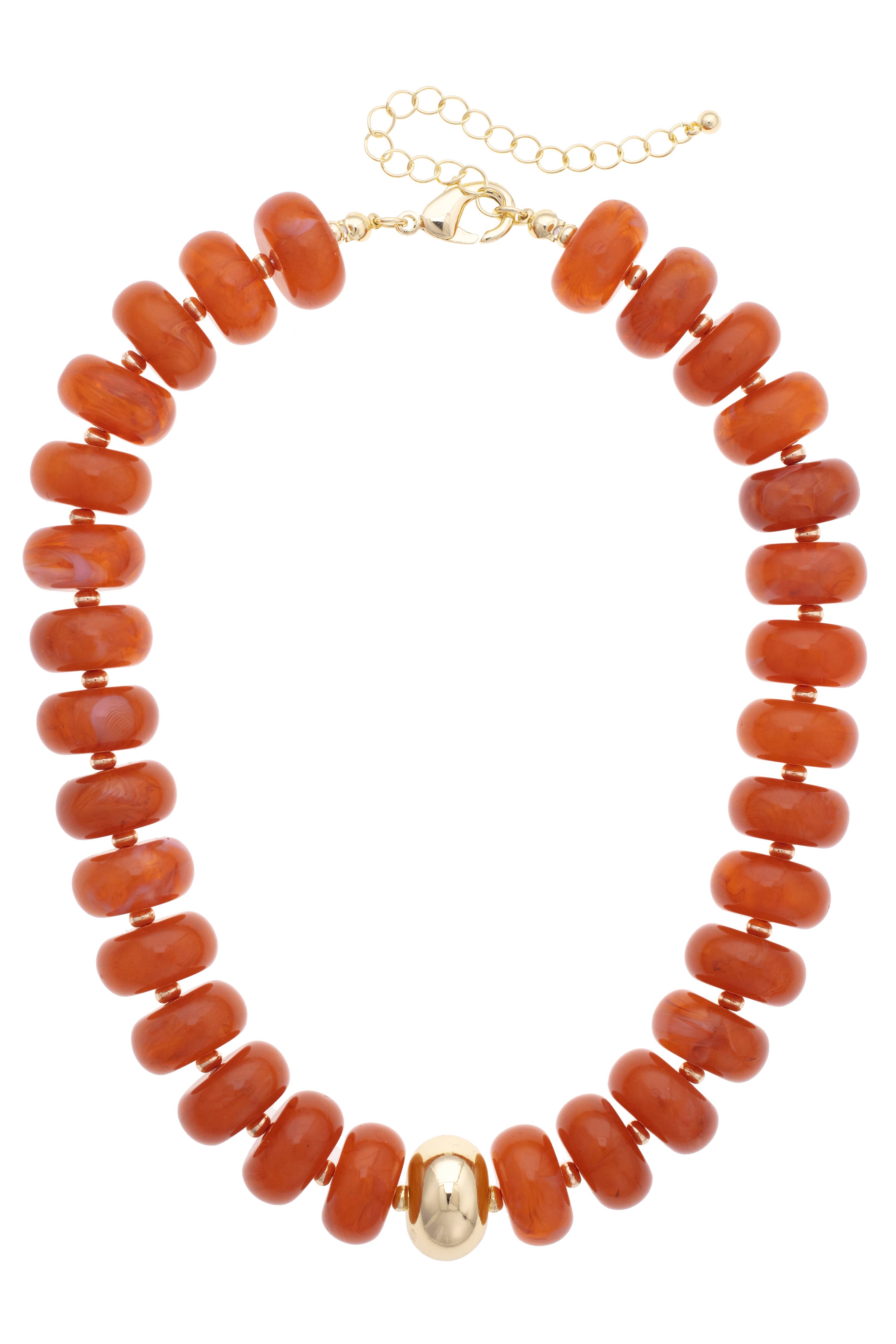 The San Sebastián Beaded Resin Necklace by Canvas Style features chunky orange resin beads with a single large gold bead at the center and a gold adjustable chain clasp. This statement necklace adds a vibrant touch to any look.