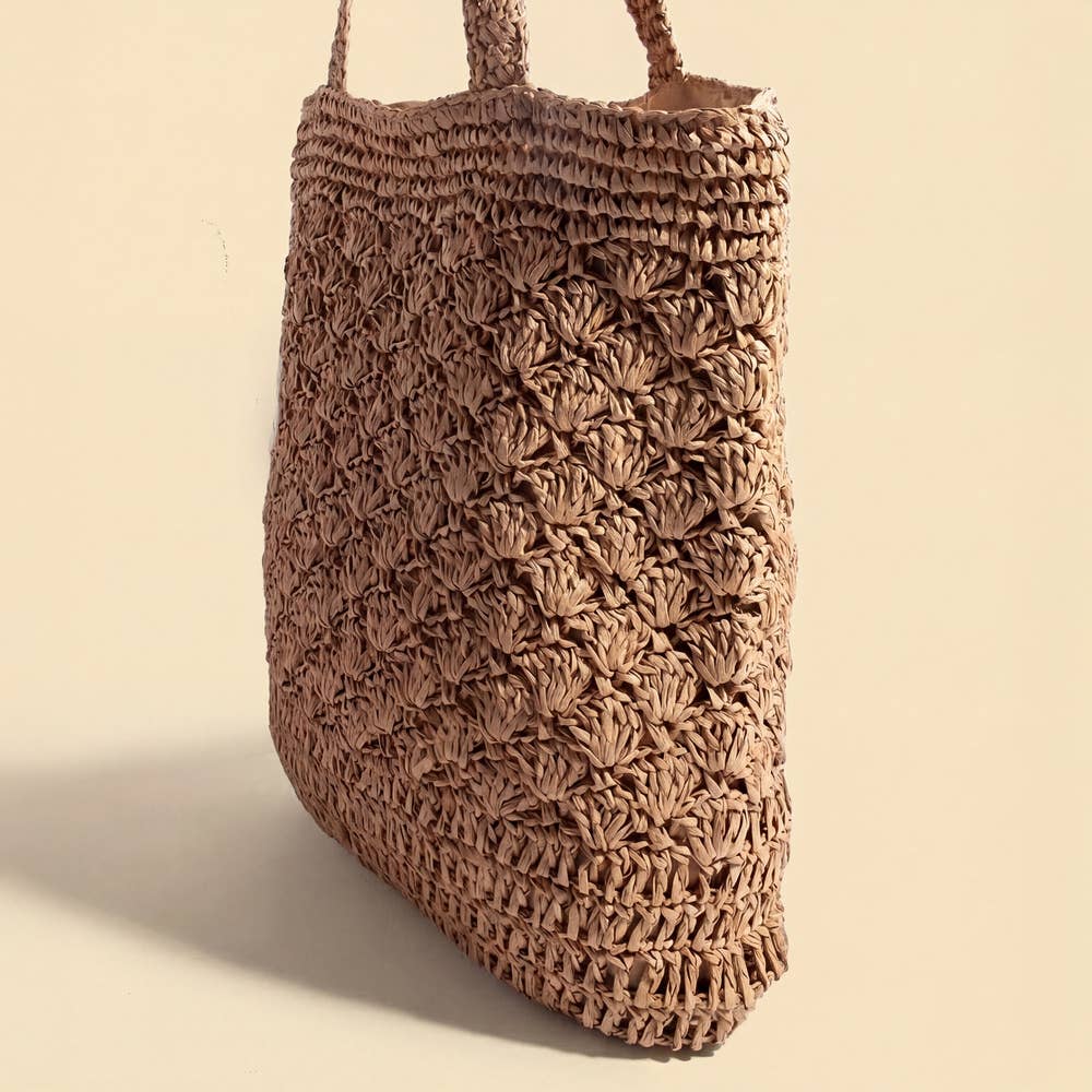 The Anarchy Street Large Woven Straw Fan Stitch Shoulder Tote Bag features a textured, patterned design and two handles—ideal for carrying in style as your go-to summer beach bag.