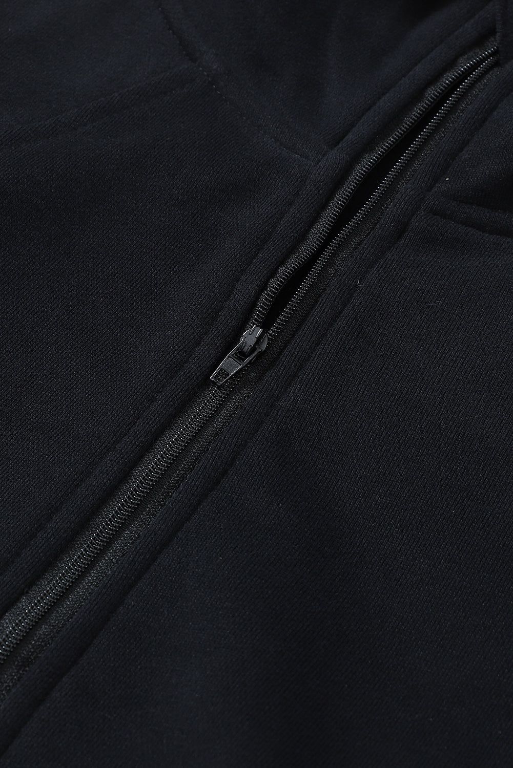 The Shewin Gray Zip Up Stand Collar Ribbed Thumbhole Sleeve Sweatshirt, featuring a sleek ribbed design and a practical stand collar, hangs elegantly on a wooden hanger.