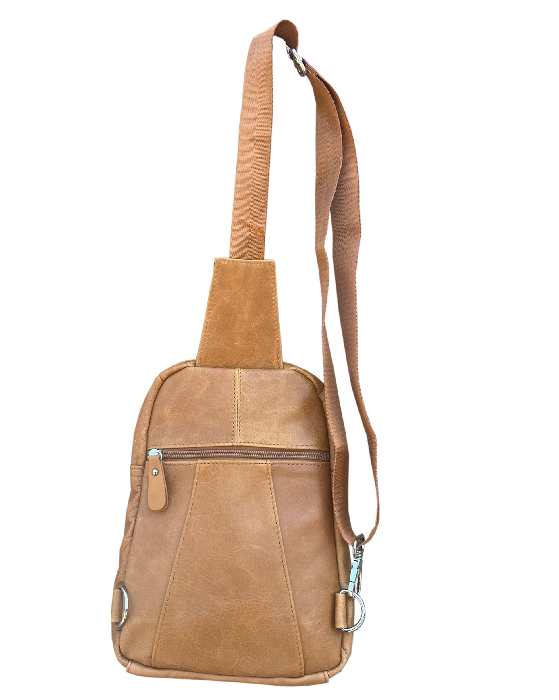 The Roma Leathers, Inc. Cowhide leather sling bag backpack features a tan finish, zippered front pocket, adjustable shoulder strap, and metal hardware, showcased against a white background.