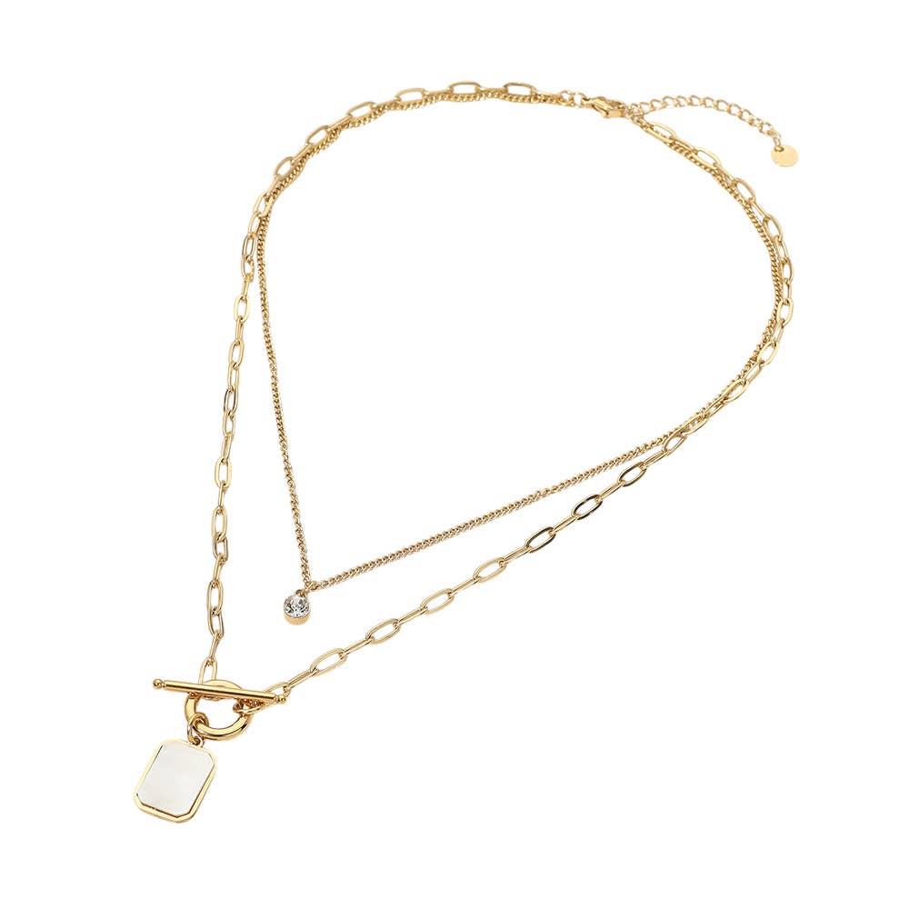 Introducing the Stainless Steel Mother of Pearl Rectangular Frame Toggle Pendant Round Stone Accent Layered Necklace by Sensibling Corp.—a gold double-layered necklace featuring mixed chain styles, with one layer adorned by a small round stone accent and the other showcasing a rectangular mother of pearl frame pendant with a toggle clasp. Crafted from durable stainless steel for lasting style and modern elegance.