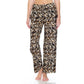 A person wears Leggings Depot Buttery Soft Print Pajama Pants with a brown, black, and beige leopard pattern, elastic waistband, standing barefoot against a white background.