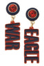 Officially licensed Auburn Tigers earrings by Canvas Style, this pair of mismatched resin block letter earrings features striking navy and orange circular studs; one earring reads “WAR” and the other reads “EAGLE” in raised navy text on a vibrant orange background.