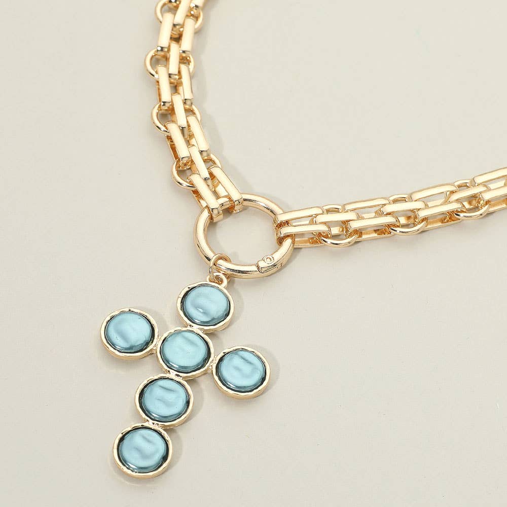 Introducing the Pearl Cross Charm Pendant Chunky Chain Statement Necklace from Sensibling Corp.—a bold gold chain necklace featuring a textured cross pendant accented with six round, light blue stones.