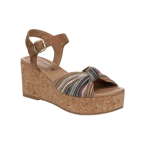 Introducing the Adore Retro Blanket Print Wedge Sandal by Caleres—a women’s wedge sandal featuring a cork sole, a tan ankle strap with buckle closure, and a multicolored blanket print upper accented with a front knot for distinctive Southwestern-inspired flair.