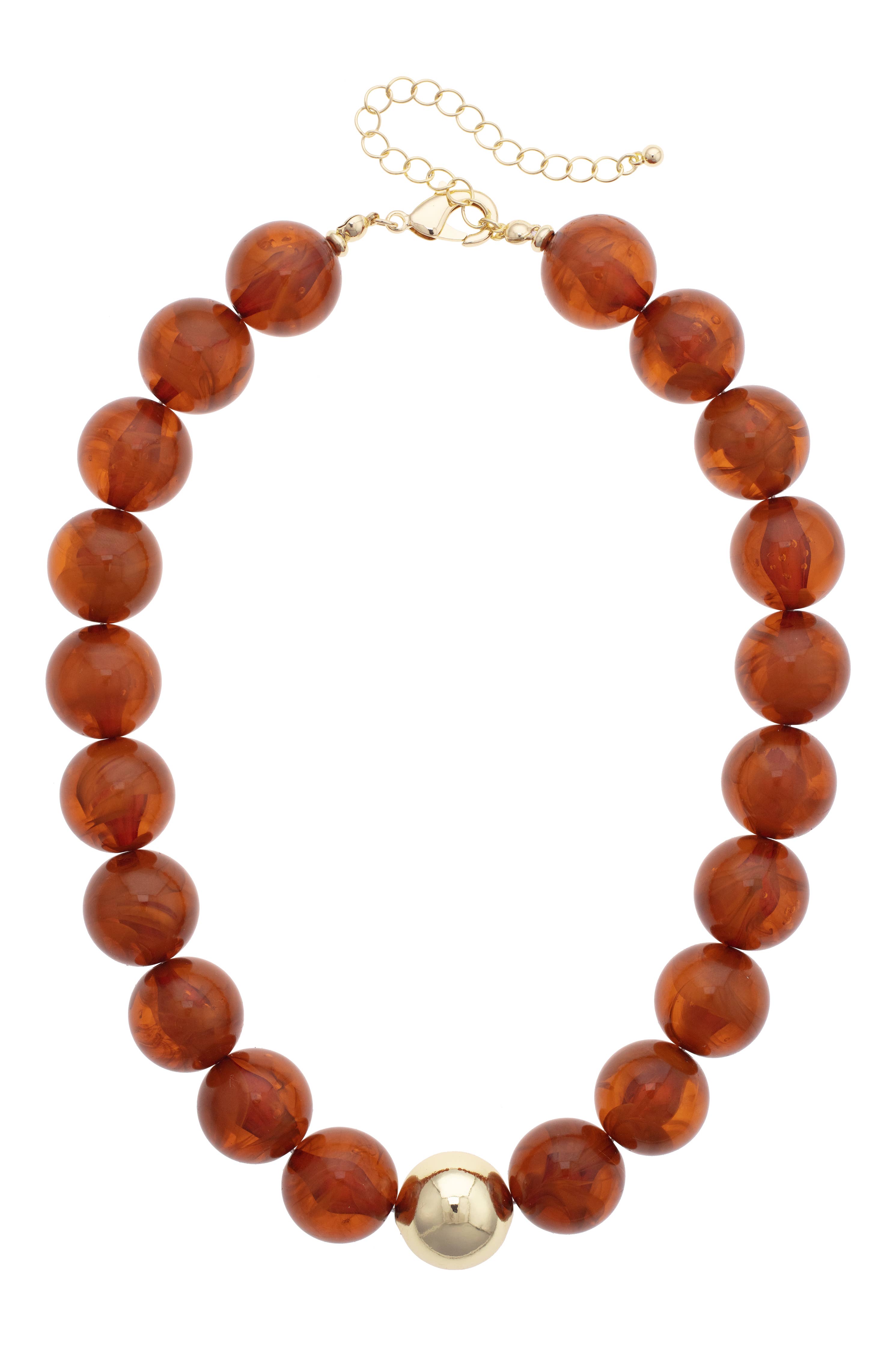 The Marjorie Fall Beaded Necklace by Canvas Style features oversized amber-colored resin beads accented with a single large gold bead at the center and is finished with an adjustable gold clasp.