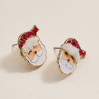 Lilla Haven's Santa Claus Stud Earrings—Red Rhinestone Christmas Earrings—feature charming Santa face designs with red hats, white trim, and gold outlines, beautifully displayed on a light surface and perfect for bringing festive sparkle to your holiday jewelry collection.