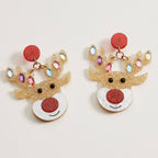 Glitter Rudolph Reindeer earrings featuring red nose accents, red circular studs, and antlers decorated with colorful, crystal-like stones as festive Christmas jewelry.