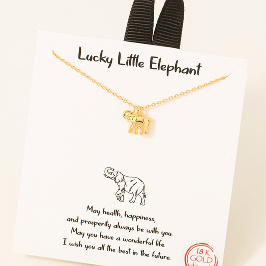 Handmade gold dipped elephant pendant necklace by FASHION GO on a card labeled "lucky little elephant" with a message wishing happiness and prosperity.