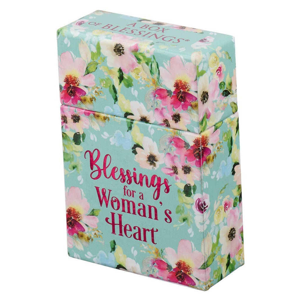 A small rectangular Box of Blessings Blessings for a Woman’s Heart with a light blue background, decorated with a pink and white floral pattern and the text “Blessings for a Woman’s Heart.”