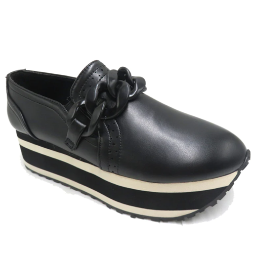 The PIERRE DUMAS PALOMA BLACK SLIP ON SHOE by OLEM SHOE CORP features a black faux suede upper with a plastic chain embellishment, paired with an eye-catching black and white striped 2-inch platform sole and stitch accents.