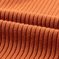 A close-up of the Shewin Patch Pocket Ribbed Knit Short Sleeve Sweater shows its rust-colored fabric with a soft texture and evenly spaced vertical lines, ideal for transitional weather.