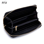 The ACCITY ZIPPER TASSEL ANTI-THEFT BRUSH LEATHER WALLET features multiple card slots, compartments, a central zippered pocket with a stylish tassel, and RFID protection for added security.