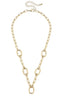 The Avery Multi-Charm Collector Necklace Base in Shiny Gold by Canvas Style features large oval links spaced along the chain and an adjustable clasp at the back, displayed on a white background. This adjustable necklace offers both style and versatility for any occasion.