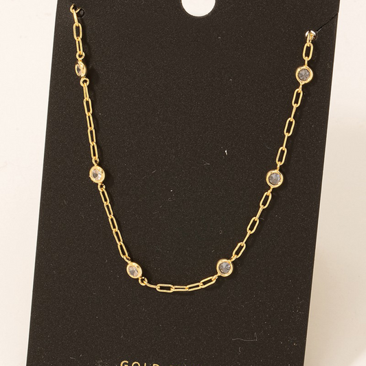FASHION GO Gold Dipped Rhinestone Necklace with circular diamond accents displayed on a black background.