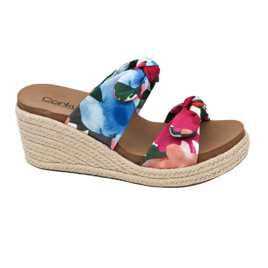 The Tie the Knot Floral Wedge Sandal by CORKY'S FOOTWEAR INC features a rope-textured sole, tan footbed, and colorful floral fabric straps with a stylish knot design for added comfort.