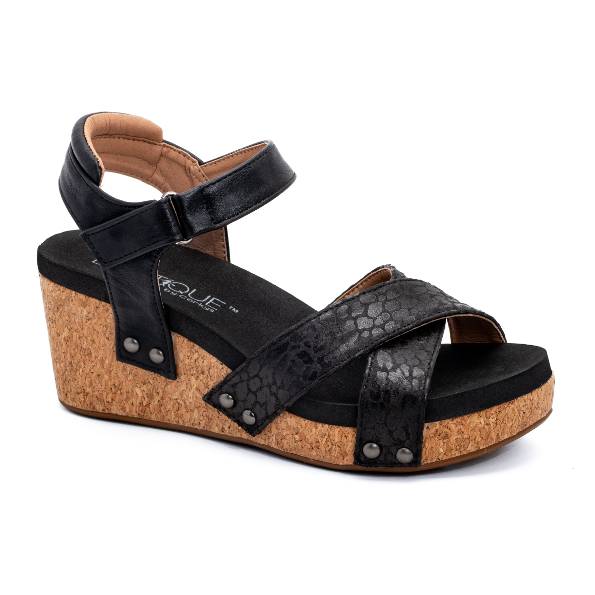 CORKY'S FOOTWEAR INC Kindle black wedge sandal with a cork heel, featuring a crisscross front strap, ankle buckle, and studded details.