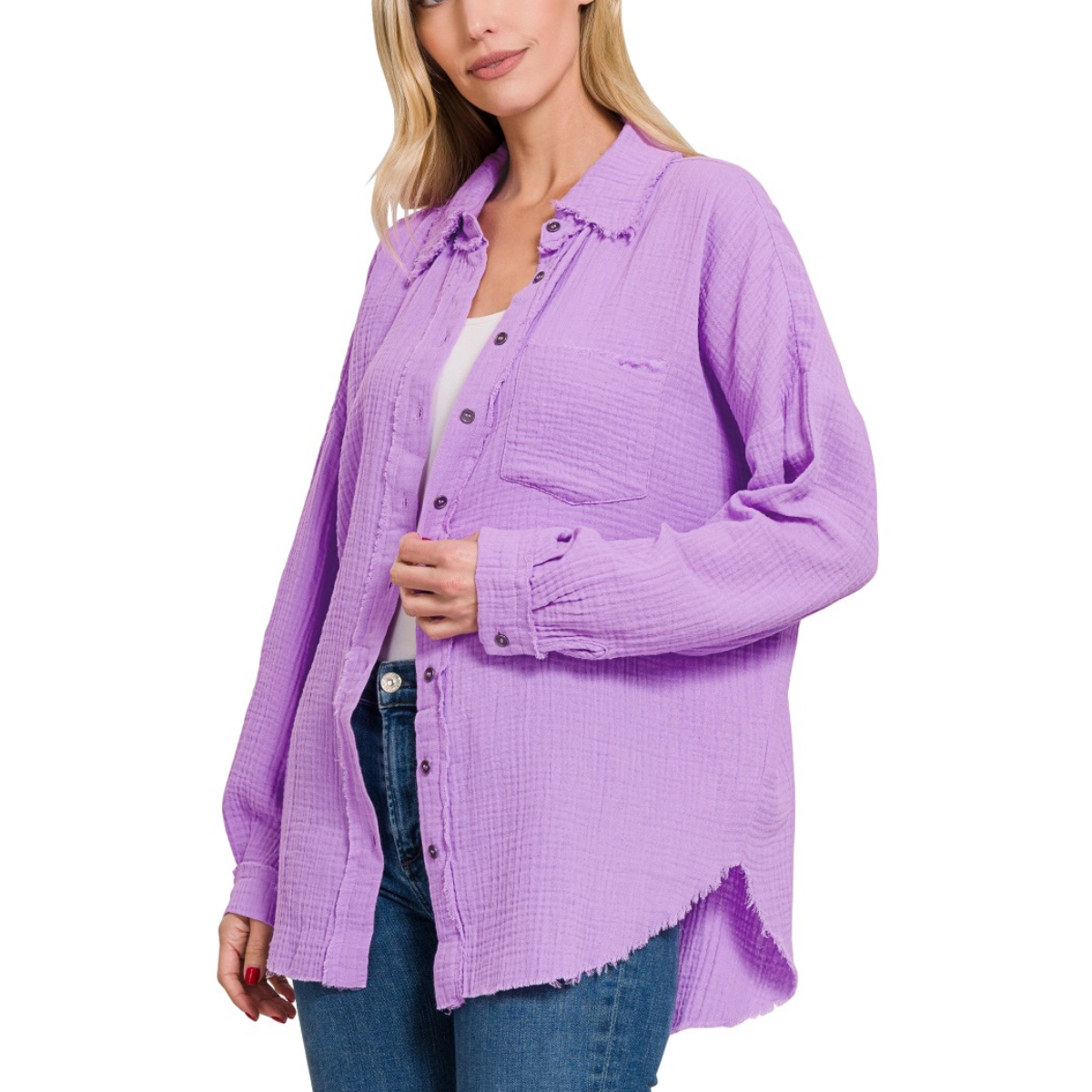 A woman wearing a FASHION GO Gauze Oversized Raw Edge Button Up Shirt and jeans.