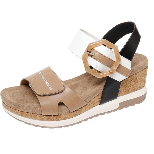 A beige and black Lyra women's wedge sandal with a cork heel and an ornamental buckle by Pierre Dumas.