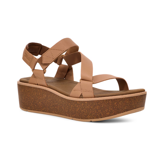 A single sandal with tan leather straps and a cork platform sole, featuring a back strap for support and an open toe design. This Deckers Teva Madera Platform Sandal in Tiger's Eye also includes a recycled rubber outsole, making it both stylish and sustainable.