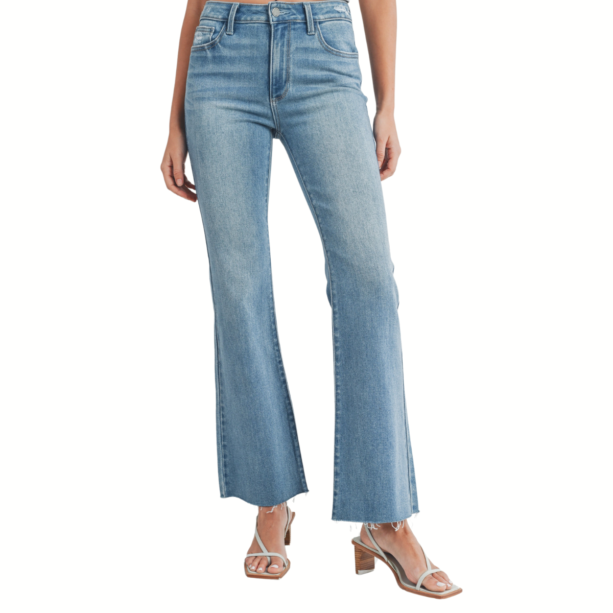 A model wearing high-waisted, Flare Jeans with Frayed Hem Detail in Medium Denim by JBD and strappy heels.