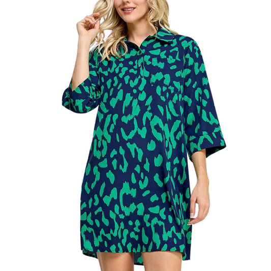 A woman wearing a relaxing 3/4 Sleeve Teal and Navy Print Dress made of breathable woven fabric by FASHION GO.