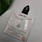 A Natural Pearl 16 inch Carded Necklace by SPECIAL EFFECTS, featuring a pearl pendant on a silver chain, lies on a white surface near a green leaf. The package text emphasizes the uniqueness of freshwater pearls with an inspirational message.