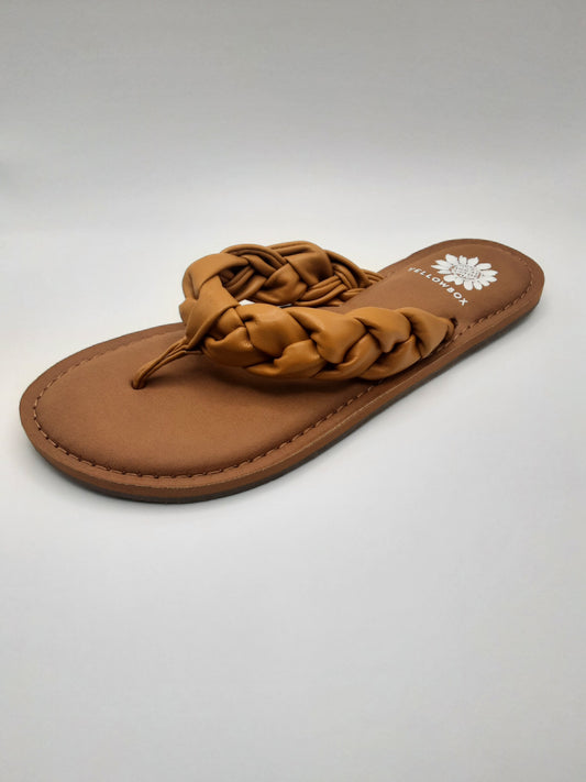 A Yellow Box - CIT flip-flop sandal, the DAUPHINE MARIGOLD model, in brown with padded braided straps and a white floral logo on the insole, set against a plain white background.