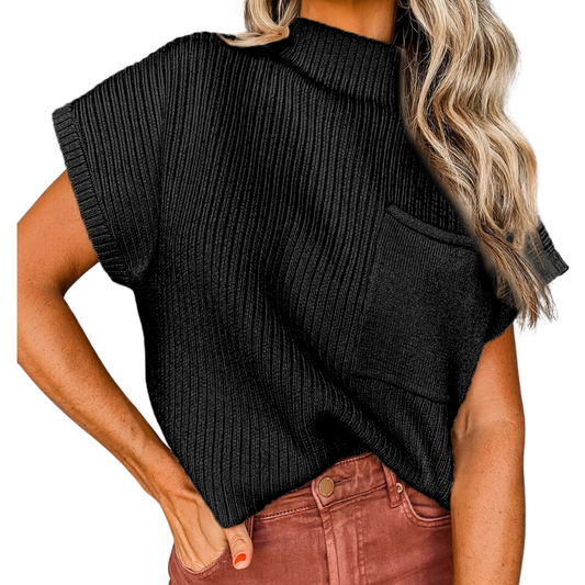 A trendy woman wearing a cute Fashiongo Patch Pocket Sweater in Black, a ribbed knit top with a pocket.