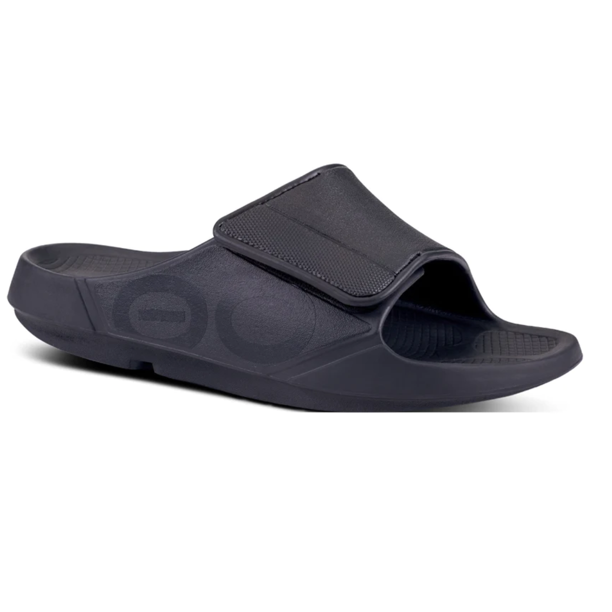 Black Sport Flex Matte Black slide sandal with adjustable upper strap on a white background by OOFOS LLC. Main image