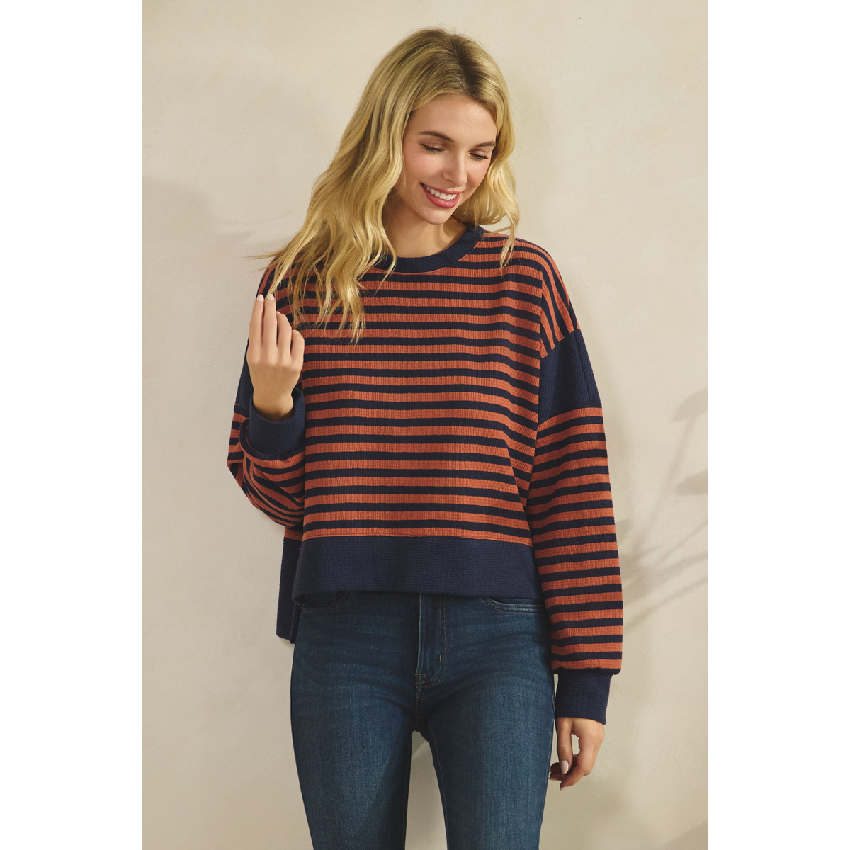 Stripe Cloudy Knit Top with navy and rust-colored stripes, long sleeves, dropped shoulders, and a round neckline Main image