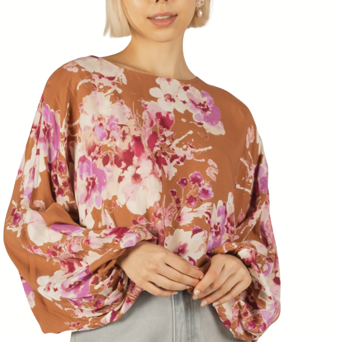 Woman wearing a Before You Floral Balloon Sleeve Top with flowers and denim jeans, perfect for spring.