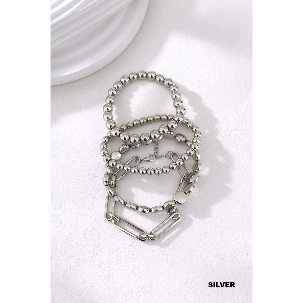 Silver-tone four-piece bracelet set with bead bracelets, disc links, and paperclip chain