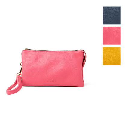 A pink, yellow, blue, and green Convertible Crossbody Wallet made of vegan leather from DM MERCHANDISING INC.