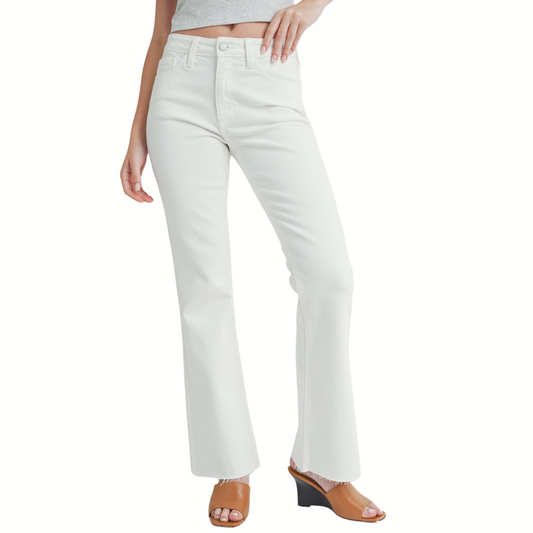 Woman wearing Flare Jeans with Frayed Hem Detail in White (JBD) by FASHION GO and tan open-toe heels.