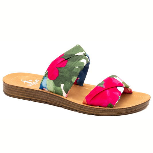 A single slide sandal with a colorful floral pattern on a white background, perfect for any summer outfit - With a Twist Floral Flat Sandal by Corky's from CORKY'S FOOTWEAR INC.